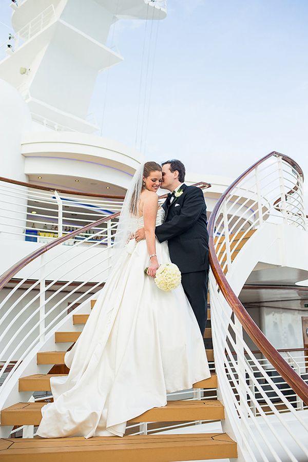 Couple kissing on ship staircase