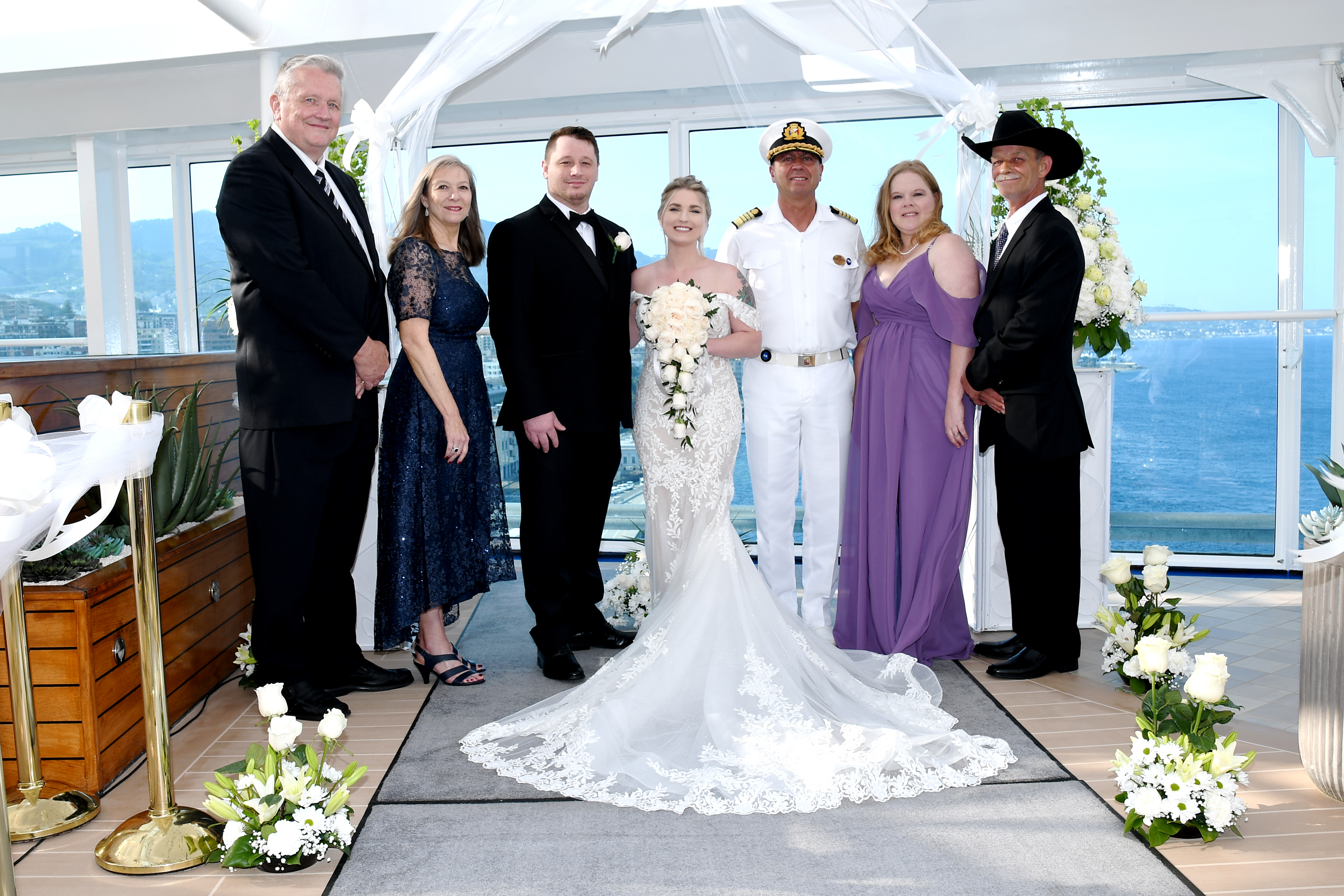 Wedding ceremony group photo with captain